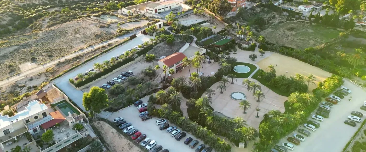 Aerial view of a finca with gardens on the Mediterranean coast